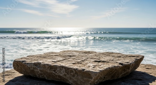 Textured rock foreground ocean waves background sunny day