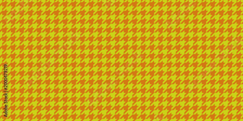 Vibrant orange and yellow houndstooth pattern.  Perfect for textile design, fashion, website backgrounds, or any project needing a bold, geometric texture.