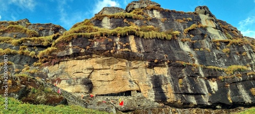 Layered rock cliff and rugged Chipla Kedar Himalayan trekking landscape