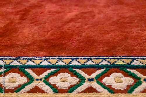 Selected focus photo of the surface of the muslim prayer mat with the Repetition Pattern.