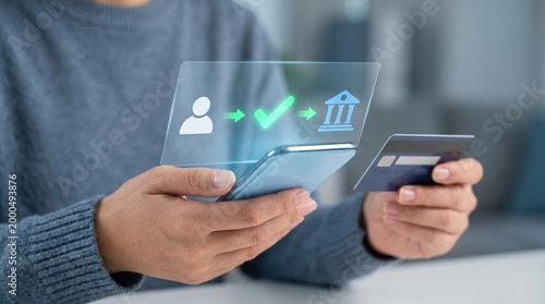A person holding a smartphone with a holographic display showing a banking transaction with a credit card.