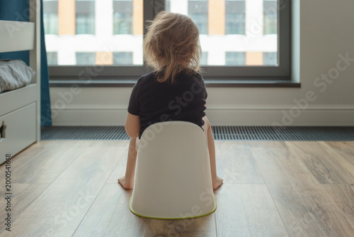 child sitting on the potty, potty training