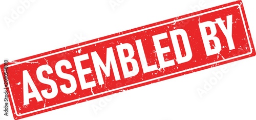 White text ASSEMBLED BY on a red distressed rubber stamp isolated background