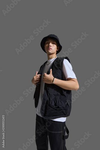 A young man with cool confidence and chic style