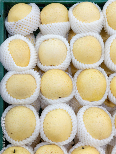 Close up of fresh ripe yellow Asian pears on display