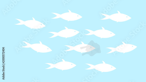 Fish swimming in group with one fish trapped in plastic waste pollution in sea