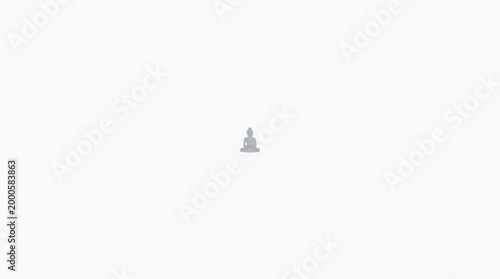 Small white ceramic Buddha statue sitting in meditation pose.