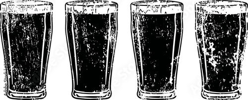 four pint glasses filled with dark beer in a row with foam bubbles on top