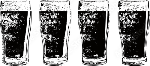 Four full pint glasses with foamy beer, close up of dark craft beverage on white background