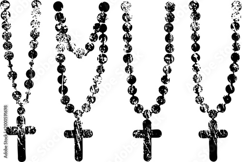 Black rosary beads with crosses hanging in a row religious symbols, christian faith accessories