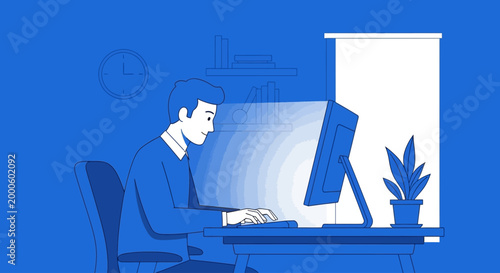 Man working on computer at desk in office