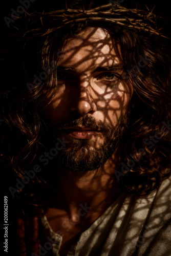 Dramatic Portrait of Man with Thorn Crown and Shadows