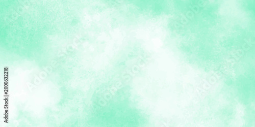 soft and serene green background with white clouds creating a peaceful and calming atmosphere. The gentle gradient of colors and perfect for use in design projects that require a soothing and natural