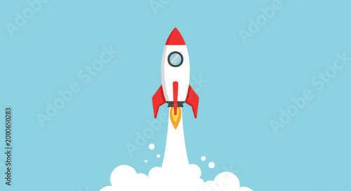 A vibrant red and white rocket ship blasting off into a clear blue sky with white cloud exhaust.