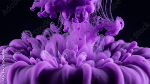 Purple ink cloud swirling in liquid
