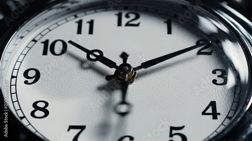 Closeup of a vintage pocket watch face showing the time.