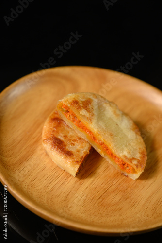 The delicious Orleans chicken pancake on the plate on the table