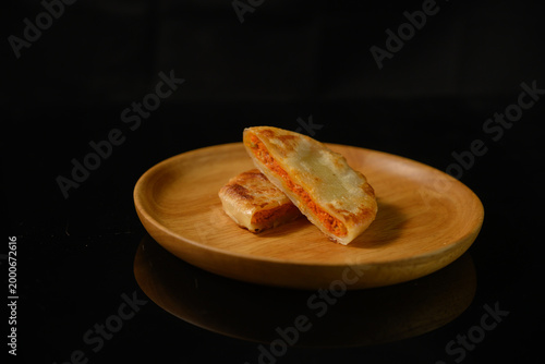 The delicious Orleans chicken pancake on the plate on the table