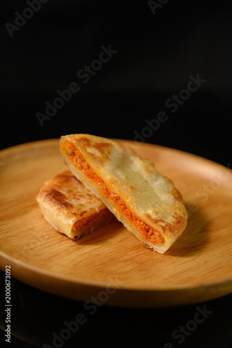 The delicious Orleans chicken pancake on the plate on the table