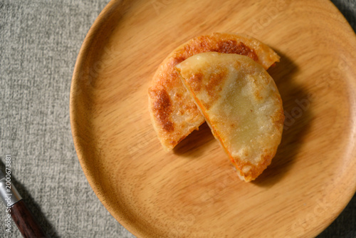 The delicious Orleans chicken pancake on the plate on the table