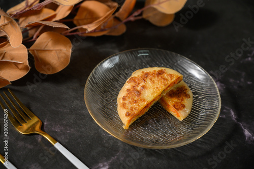 The delicious Orleans chicken pancake on the plate on the table