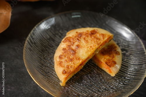 The delicious Orleans chicken pancake on the plate on the table