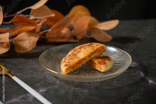 The delicious Orleans chicken pancake on the plate on the table