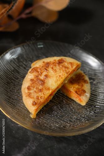 The delicious Orleans chicken pancake on the plate on the table