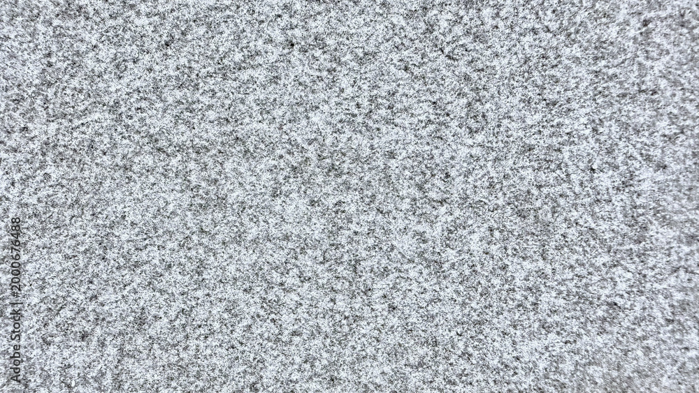 Fototapeta premium intricate gray granite texture closeup with speckled quartz crystals and mineral grains on natural stone surface