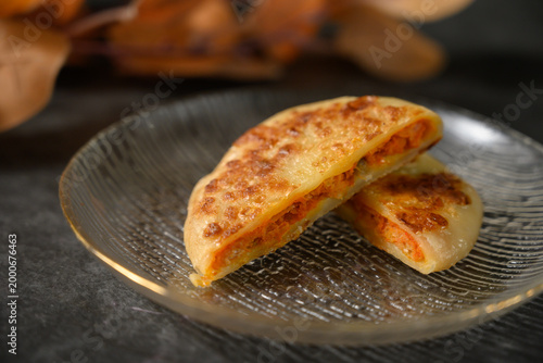 The delicious Orleans chicken pancake on the plate on the table