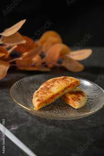 The delicious Orleans chicken pancake on the plate on the table