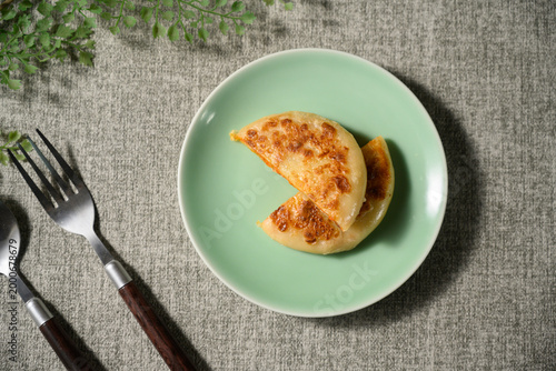 The delicious Orleans chicken pancake on the plate on the table