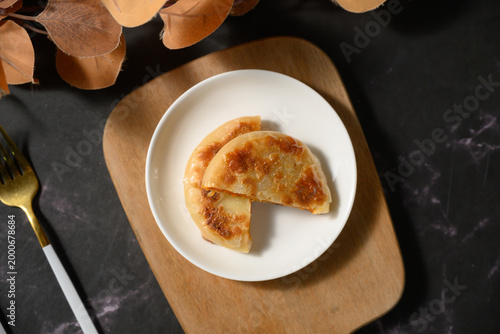 The delicious Orleans chicken pancake on the plate on the table