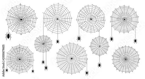 Collection of various spider web designs and black spiders hanging on thin silk threads for halloween themed projects.