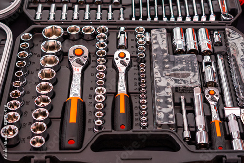 Foto Professional mechanic's socket tool set organized in a plastic carrying case