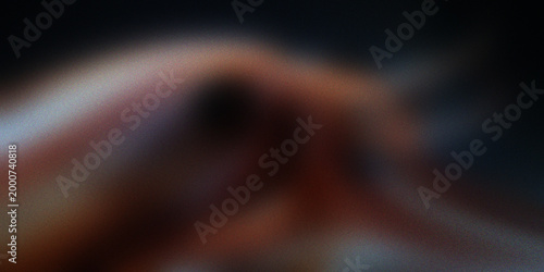 Foto Abstract dark blurry background with organic reddish shapes and grain texture suggesting soft human skin tones and shadows
