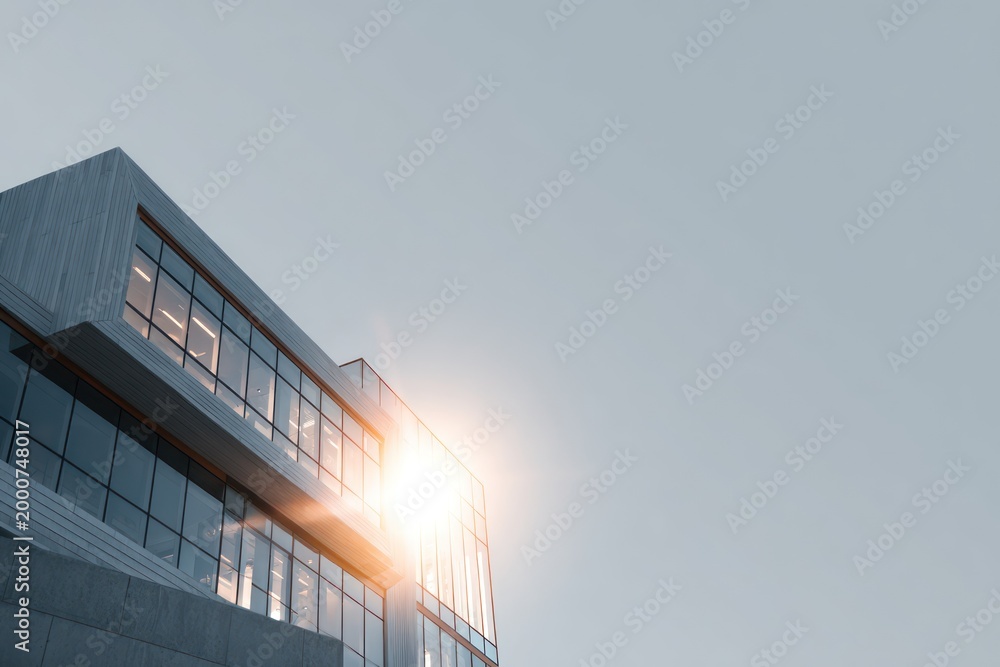 Obraz premium Sunlight reflecting on modern glass building