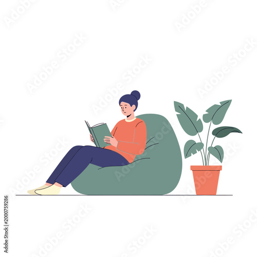 Woman reading book on bean bag chair