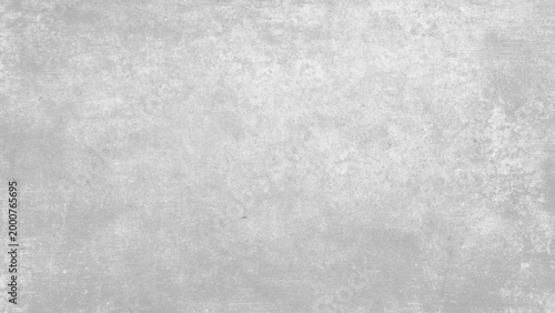 Gray textured concrete wall surface with scratches and imperfections