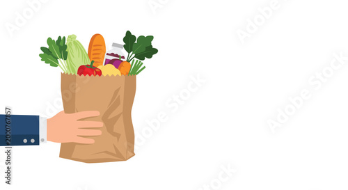 Hand holding a brown paper grocery bag filled with fresh vegetables, bread, and a bottle against a clean white background.