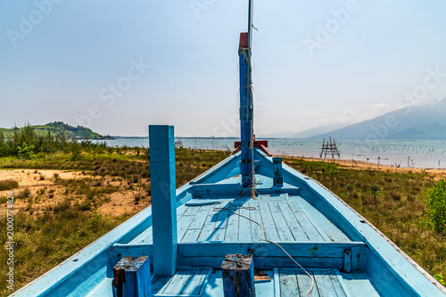 Canvastavla A view from the front of a beached sampan over the Lap An Lagoon in Vietnam on a