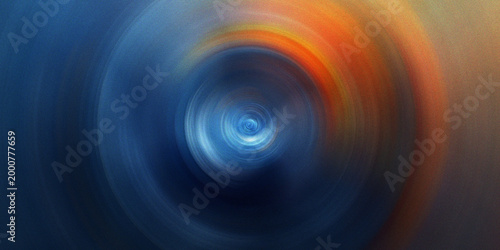 Circular motion blur background with vibrant blue and orange radial energy burst creating dynamic abstract focal point art.