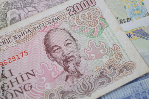 Bild auf Leinwand Vietnamese Dong banknote highlighting the fine printing details and textures of