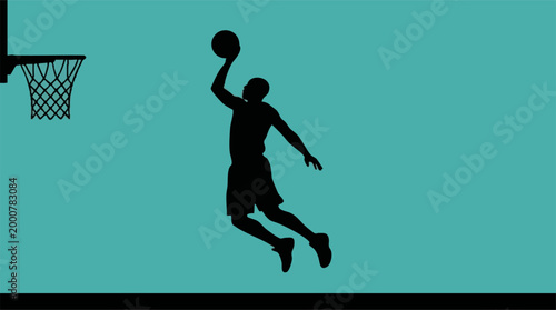 Dynamic silhouette of basketball player jumping to score a hoop