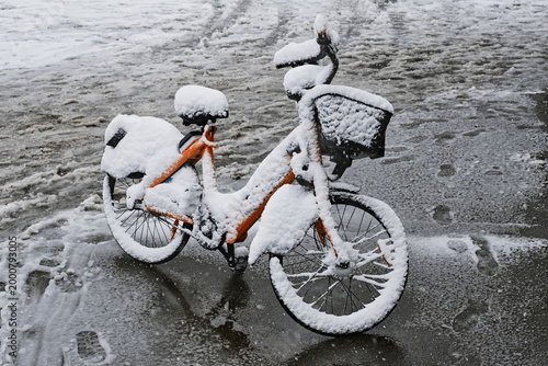 Bike in the snow. Snowfall in a spring at the city Moscow,  Russia, April ,2026