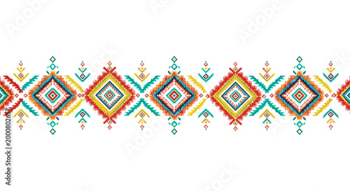 Colorful ethnic border design featuring red, yellow, and turquoise geometric diamond motifs on a white background.