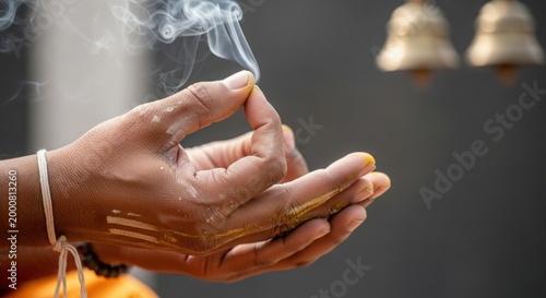 Spiritual ritual with hands performing prayer and incense smoke rising in ambiance. Spiritual ceremony includes soothing incense and sacred atmosphere for reflection.