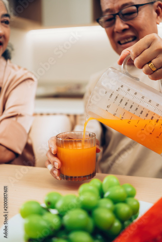 Senior Couple Enjoying Fresh Juice Together