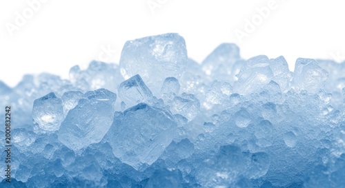 A pile of clear crushed ice cubes and small frozen water pieces showing a cold and refreshing winter texture