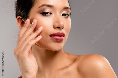 Slika na platnu Elegant Asian woman with flawless skin posing for a beauty skincare shoot